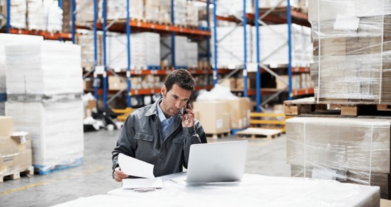 Warehouse worker on computer