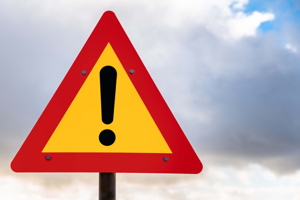 Hazard warning sign in front of clouds 3 costly mistakes made by distributors