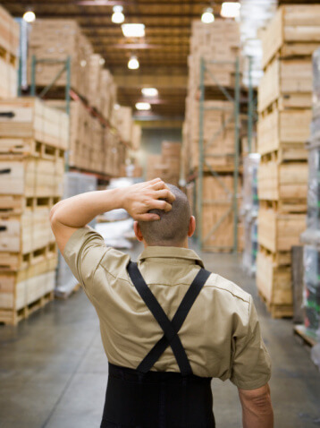 Warehouse worker looking for inventory items