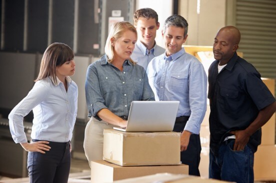 Supply Chain Management Team Working in Warehouse