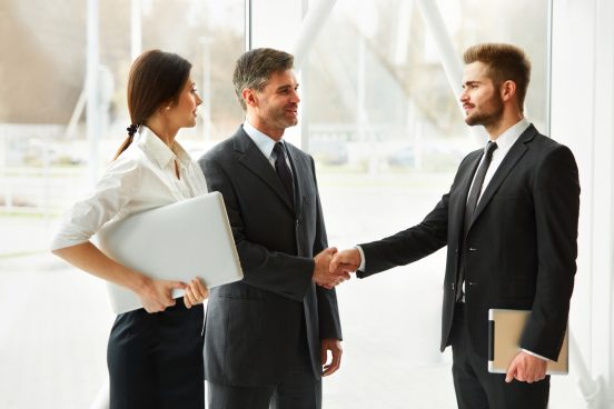 Successful business people shaking hands