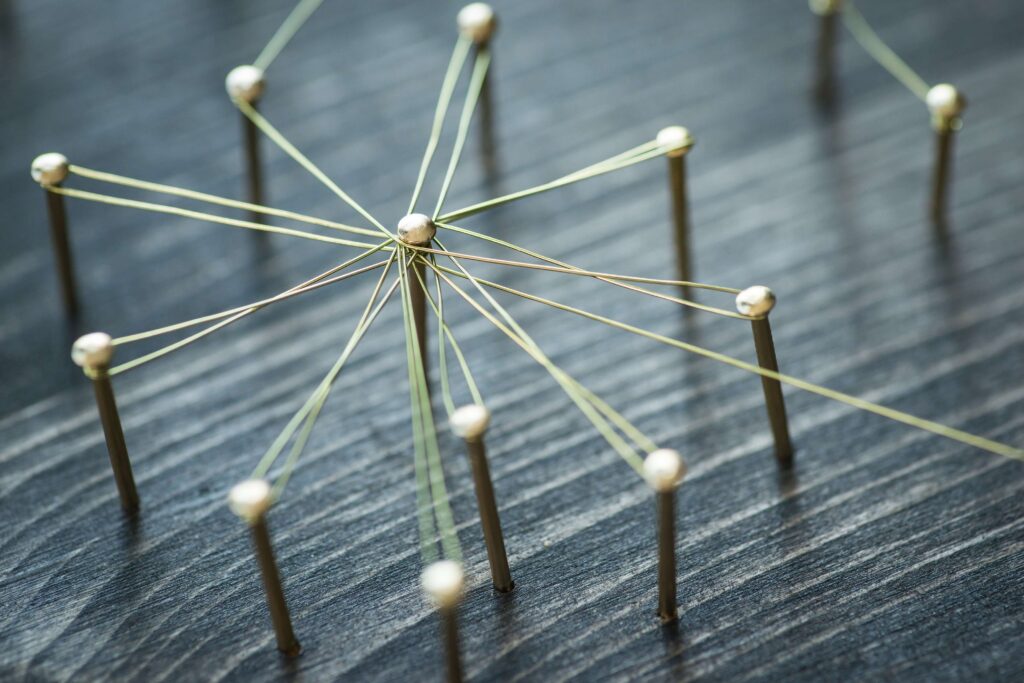 pins connected by string on a table