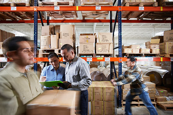 Warehouse workers moving products