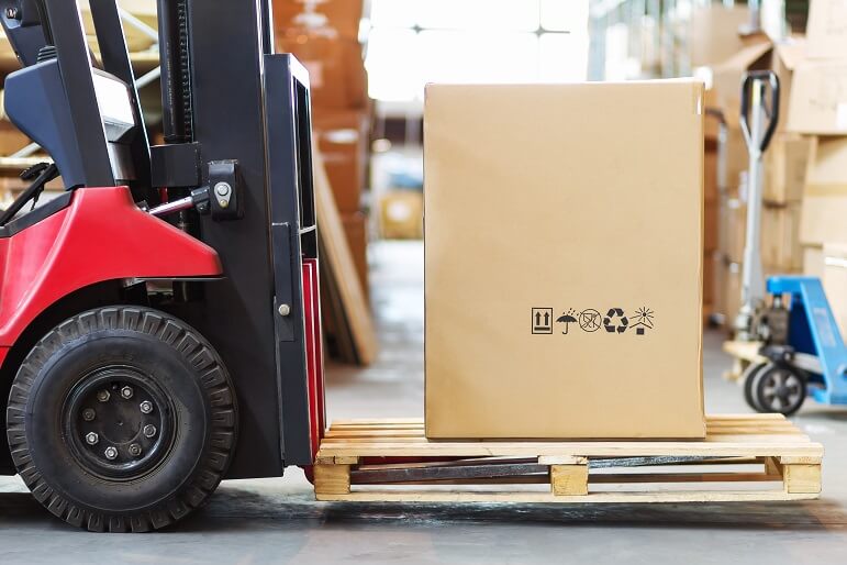 Distribution software forklift moving boxes in a warehouse