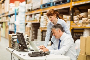 Man and woman working in warehouse