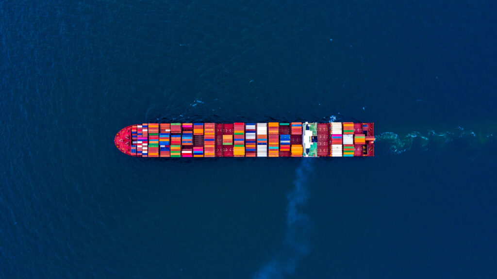Aerial view of a cargo ship with freight shipping containers why ignoring automated inventory management is killing your supply chain