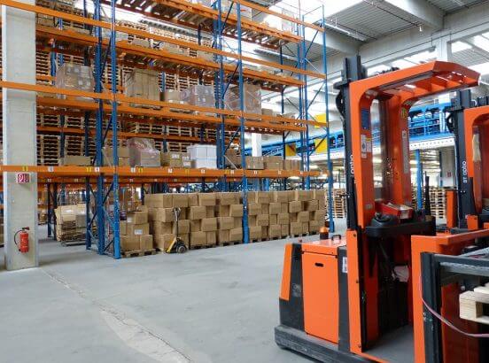 Fork lift in stocked warehouse