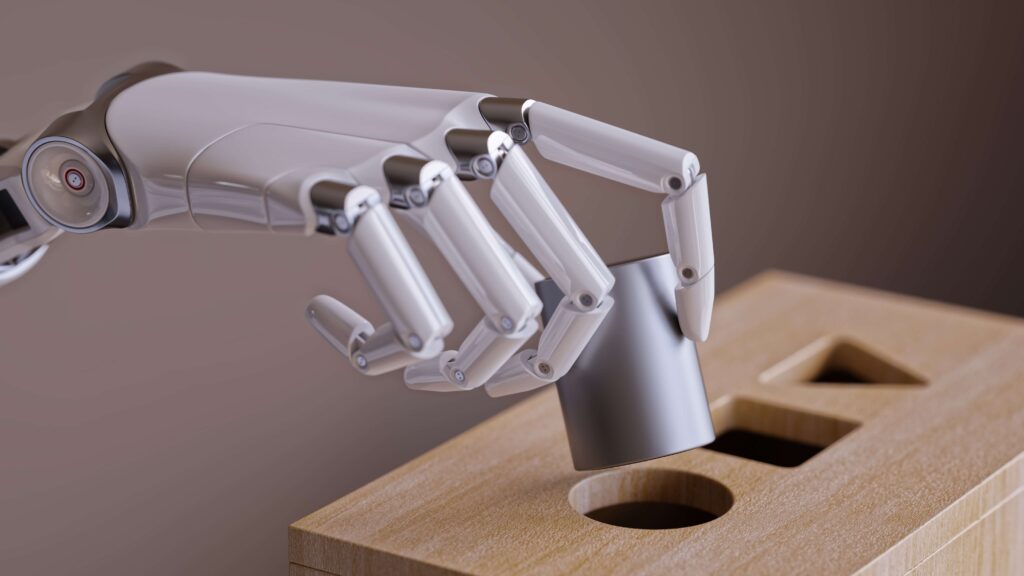 Robot hand putting shapes into holes AI machine learning