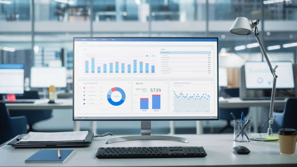 Computer screen showing charts and analysis on a table in a warehouse ERP how advanced is your ERP system