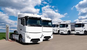 Electric cabs of trucks plugged into charging stations