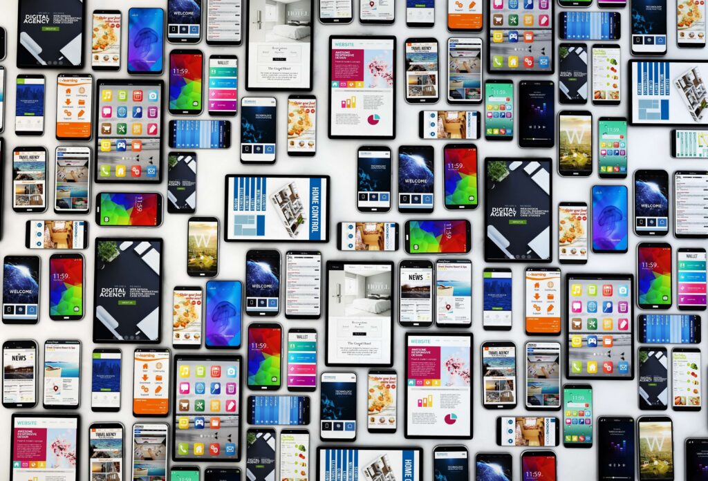 Lots of mobile devices of different sizes laid out next to each other