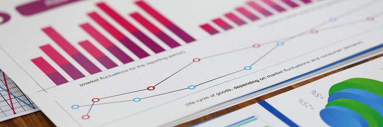 Bar charts and line charts on paper on a table