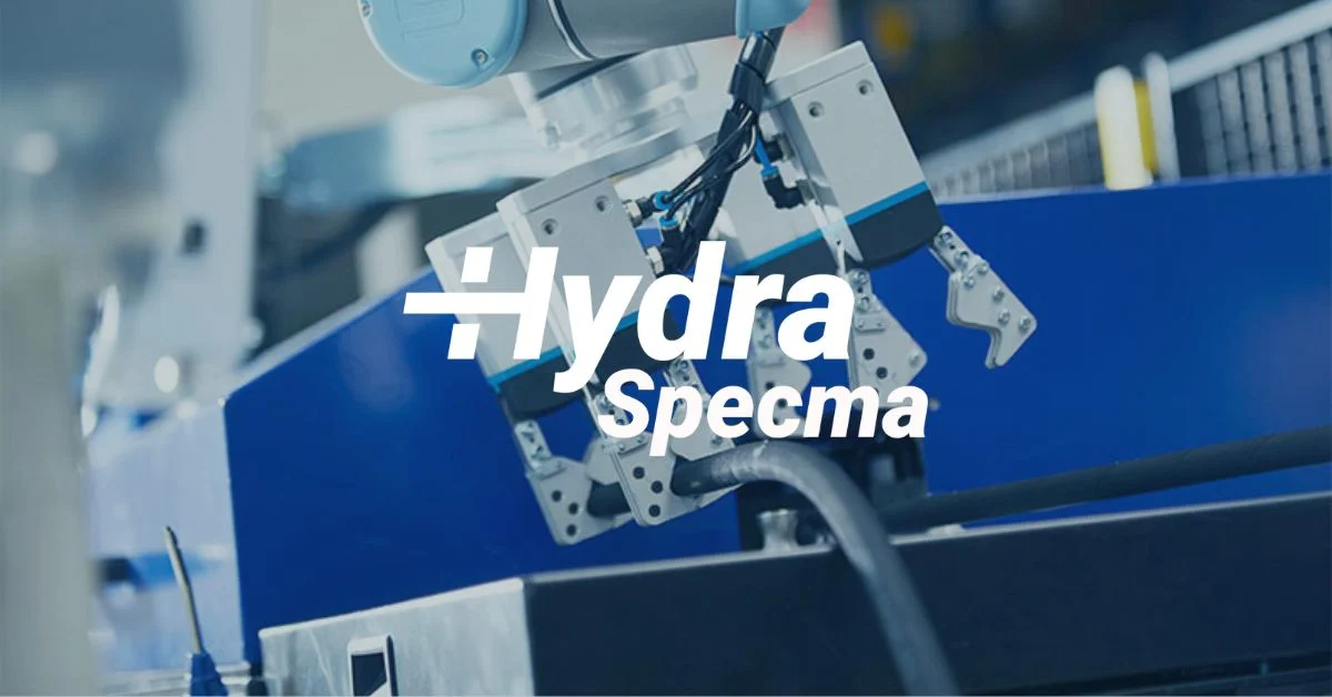 HydraSpecma logo ovanpå en hydraulikkomponent.