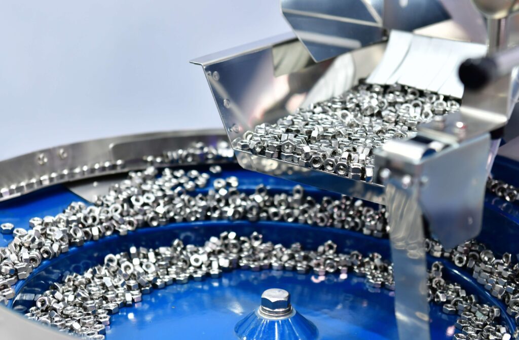 Small bolts and nuts being manufactured in a factory
Building strong relationships with your suppliers can reduce costs and allow you to negotiate more favourable terms. 