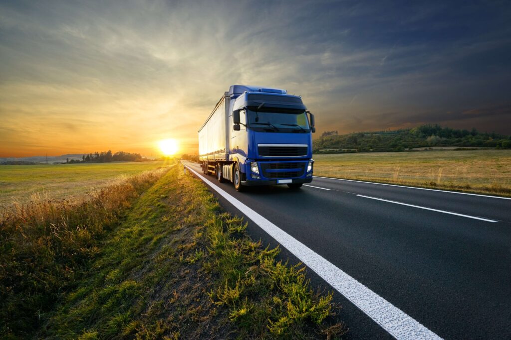 Blue lorry driving on a road at sunset
Reshoring reduces supply chain risks with shorter supply chains that are less susceptible to global disruptions providing stability and predictability. 