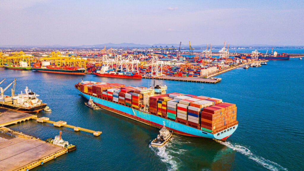Container ship carrying cargo into port tariffs how inventory optimization can help mitigate the impact of tariffs