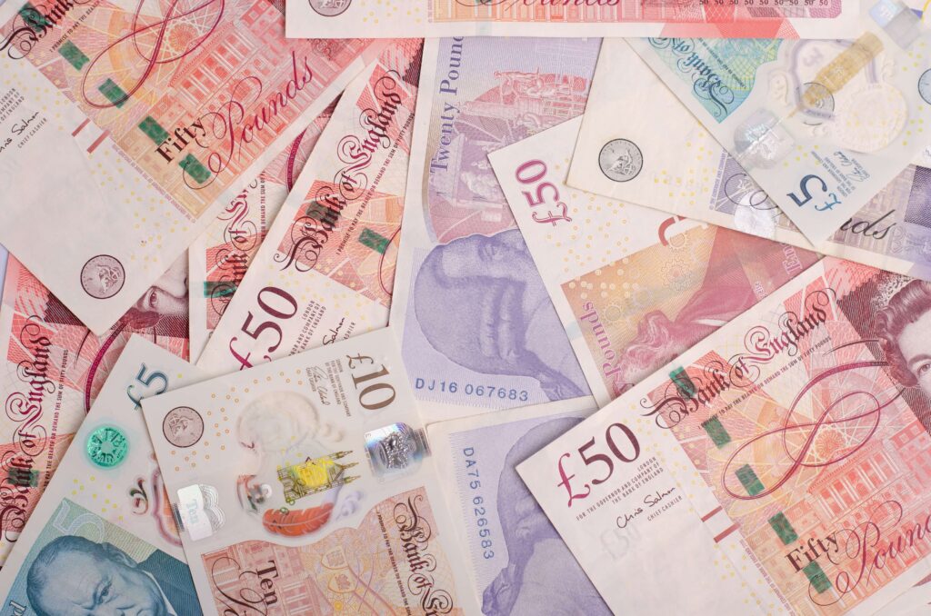 British 50 pound notes
Rising tariffs significantly impact businesses and customers, as the additional costs of importing or exporting goods must be factored into the overall cost of the product. This leaves a decision for businesses – do they absorb the extra costs or pass them on to the customer?