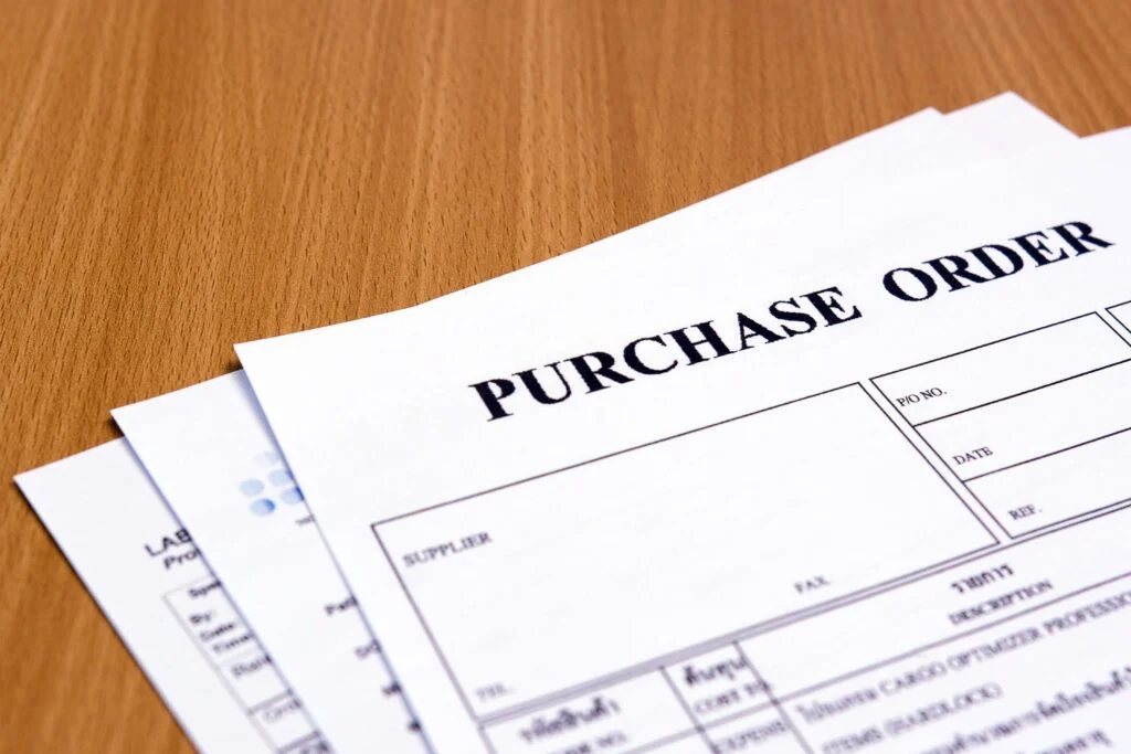 Purchase order print outs on a desk