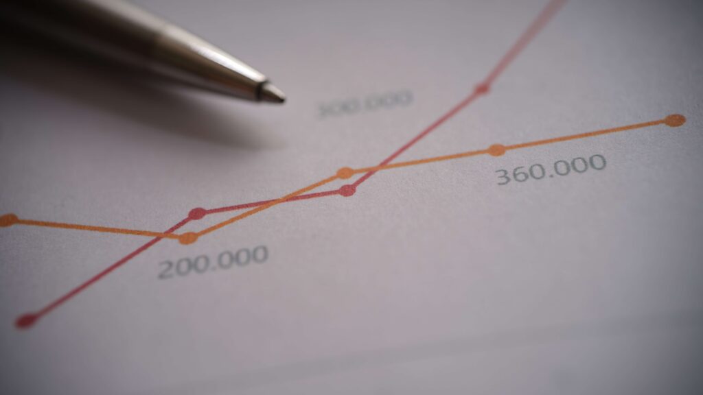 Forecasting and graphs on paper with a pen